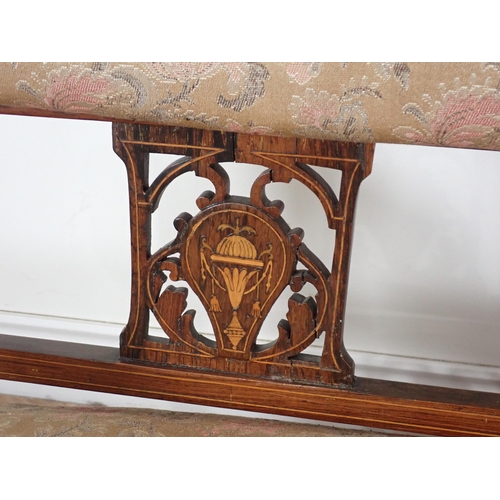 384 - An Edwardian rosewood and marquetry inlaid Settee with upholstered back and seat on turned front sup... 