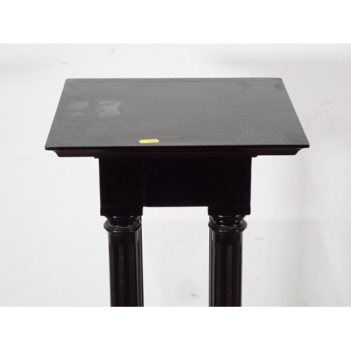 389 - An ebonised Jardiniere Stand with square top and fluted turned supports, 3ft H