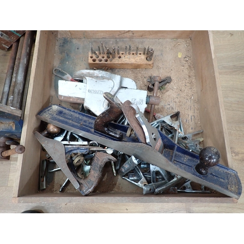 393 - A large quantity of boxes of metalworking equipment including vices, drill bits, drills, planes, nut... 