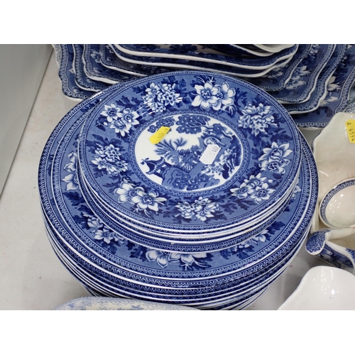 462 - A quantity of reproduction Rogers blue and white Dinnerware, including graduated meat plates, sauce ... 