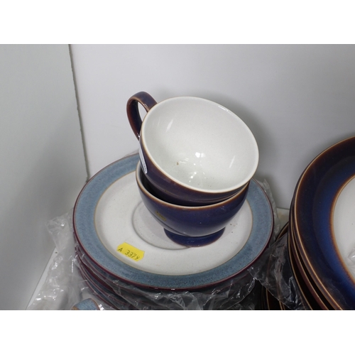 465 - A quantity of Denby 'Storm' Teaware, and a quantity of Denby 'Ametyst' Dinnerware,