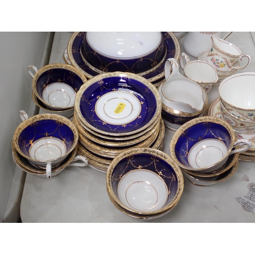 493 - A set of twelve Limoges Plates, each painted different sprays of flowers 9 1/2in diam, a Crown Staff... 