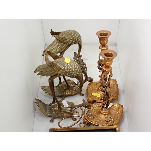 504 - A brass easel Photograph Frame, a pair of gilt figural Candlestick, and a pair of exotic Birds