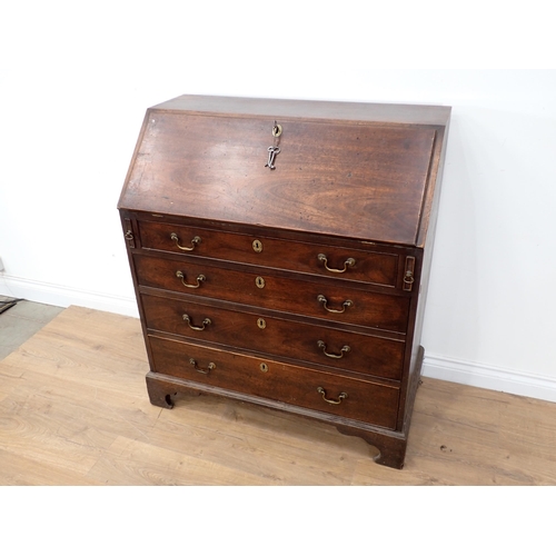 52 - A George III mahogany Bureau with fall front enclosing fitted interior above four graduated drawers ... 