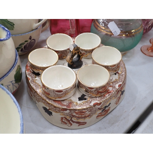 522 - A Poole part Tea Set, handle A/F, a quantity of puncture repair kits, an Egg Cup Stand, items of cra... 