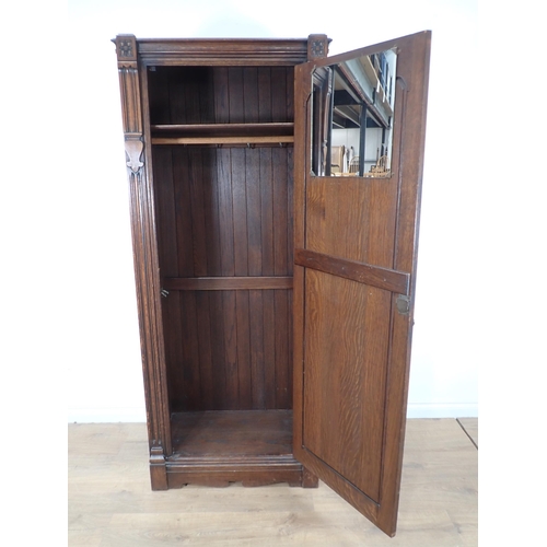 544 - An oak single door Wardrobe with rose carving 6ft 1in H x 2ft 7in W