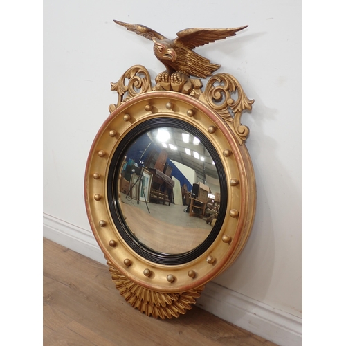 545 - A Regency style gilt framed Convex Wall Mirror with eagle surmount 2ft 10in H x 1ft 11in W