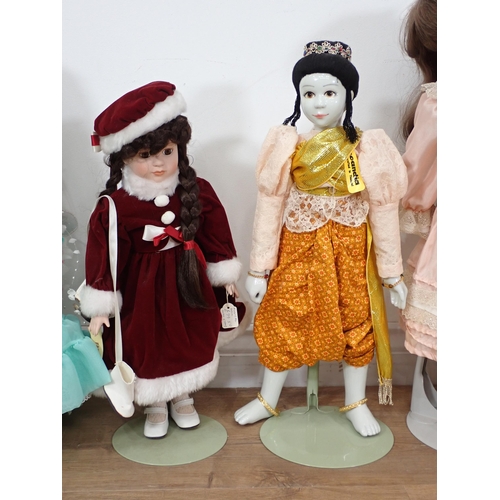 572 - Five modern bisque headed Dolls