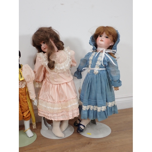 572 - Five modern bisque headed Dolls