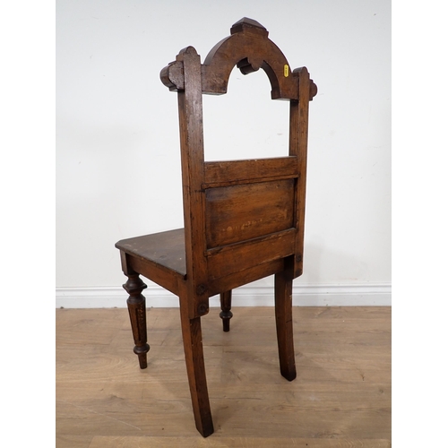 575 - An Arts and Crafts oak Hall Chair with tile back