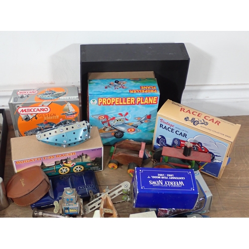 579 - A box of unboxed diecast Models, two boxed Cap Guns, tinplate Fire Engine, Meccano Boat, etc.