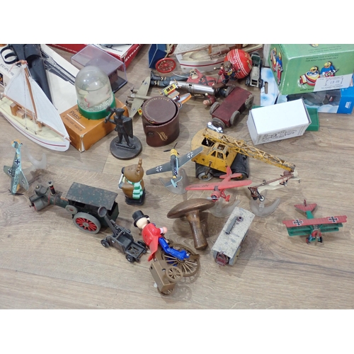 579 - A box of unboxed diecast Models, two boxed Cap Guns, tinplate Fire Engine, Meccano Boat, etc.