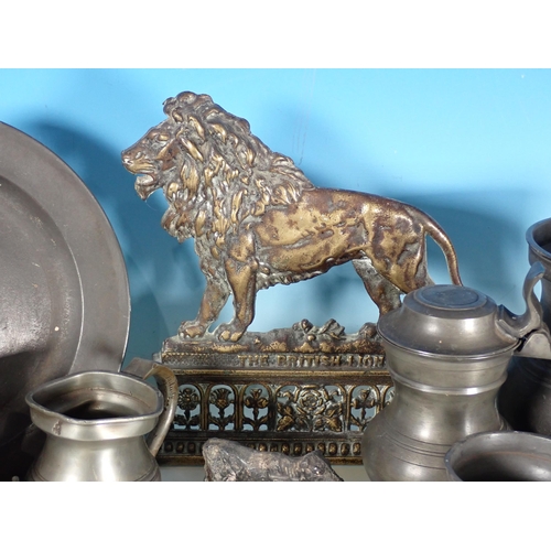 580 - A box including seven pewter Tankards, Plate, plated Coffee Pot, brass Lion, lead Cow and a gilt met... 