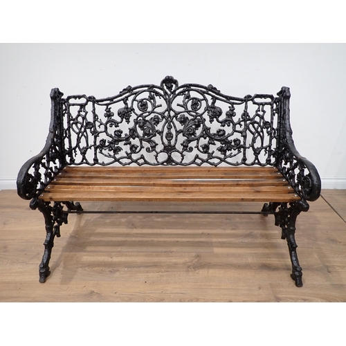 587 - A cast iron Coalbrookdale style Garden Bench of trailing leafage design with slatted seat 4ft 1in W ... 