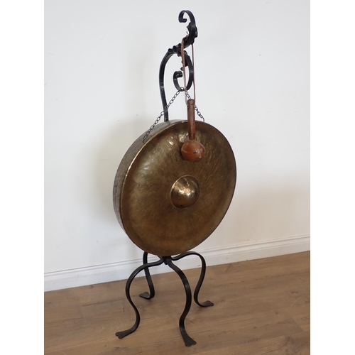 589 - An Arts and Crafts style wrought iron Dinner Gong 4ft 6in H