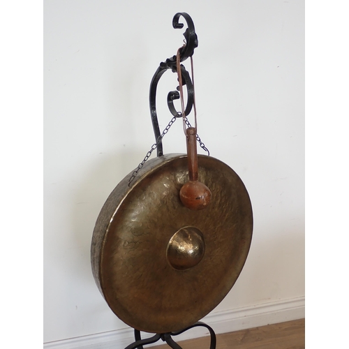 589 - An Arts and Crafts style wrought iron Dinner Gong 4ft 6in H