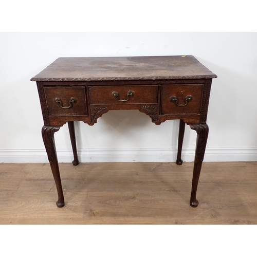 590 - An 18th Century oak Lowboy with later carving fitted three frieze drawers 2ft 5in W x 2ft 4in H