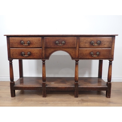 592 - An 18th Century style oak pot board Dresser Base fitted five drawers mounted on turned supports 4ft ... 