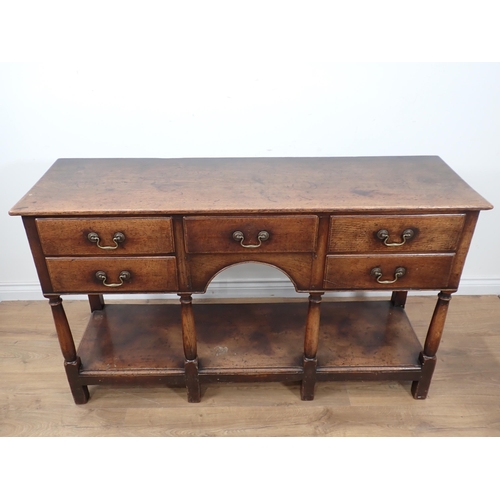 592 - An 18th Century style oak pot board Dresser Base fitted five drawers mounted on turned supports 4ft ... 