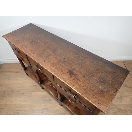 592 - An 18th Century style oak pot board Dresser Base fitted five drawers mounted on turned supports 4ft ... 