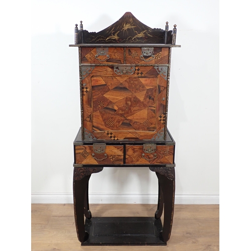 594 - A Chinese lacquered and parquetry effect Cabinet on stand 4ft 10in H x 2ft 1in W