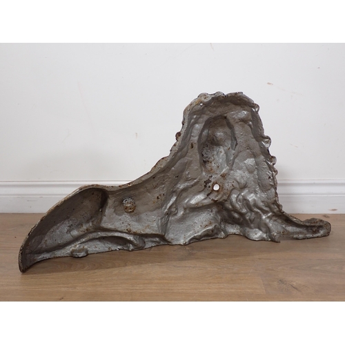 595 - A large cast iron reclining Lion 2ft 4in LW x 1ft 2in H