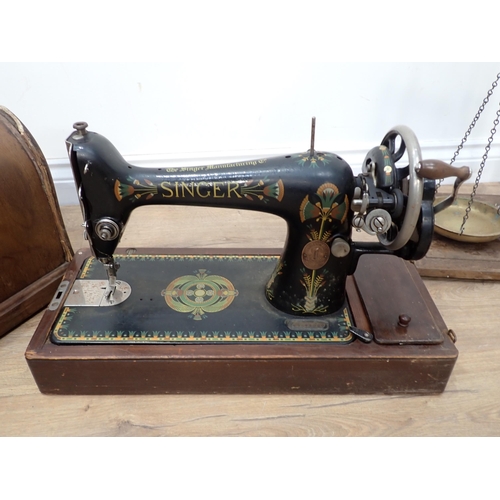 600 - A Singer Sewing Machine and a set of Balance Scales