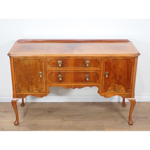 601 - A walnut veneered and ebony strung Sideboard fitted pair of cupboard doors and two frieze drawers mo... 