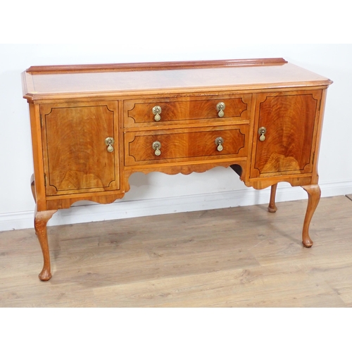 601 - A walnut veneered and ebony strung Sideboard fitted pair of cupboard doors and two frieze drawers mo... 