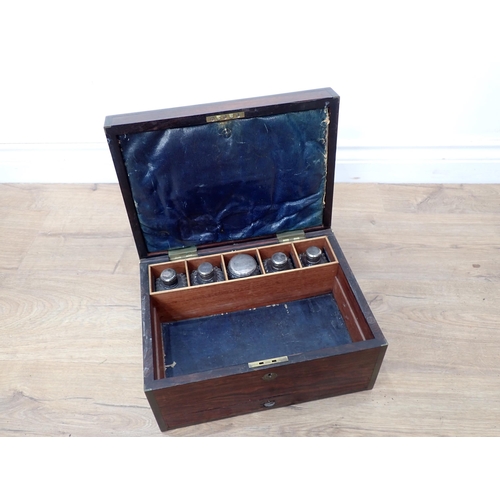 610 - A 19th Century coromandel and brass bound Dressing Box with five fitted glass bottles 12 1/2in W x 6... 