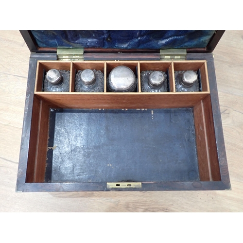 610 - A 19th Century coromandel and brass bound Dressing Box with five fitted glass bottles 12 1/2in W x 6... 