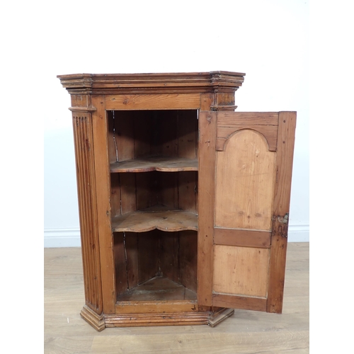 611 - An antique pine hanging Corner Cupboard with arched panel door 2ft 8in H x 1ft 10in W