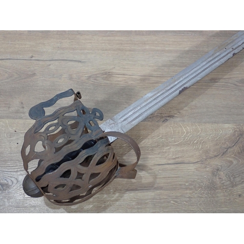 627 - A reproduction Scottish basket hilted Sword in scabbard