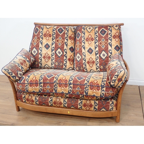 638 - A pair of Ercol Settees with stylised floral red and yellow upholstery 4ft 8in W x 3ft 2in H