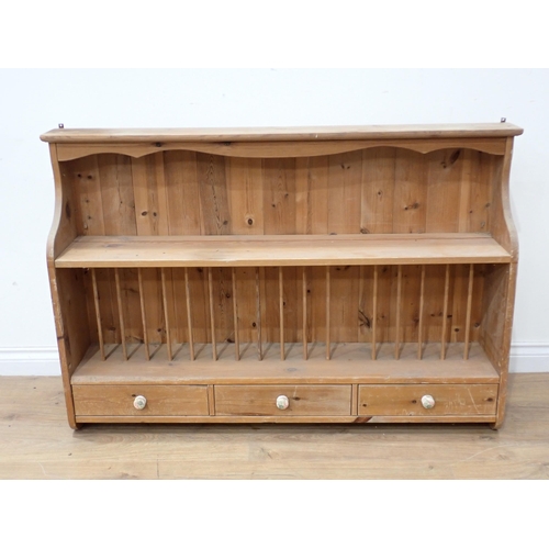 64 - A pine Plate Rack fitted three drawers 4ft W x 2ft 8in H