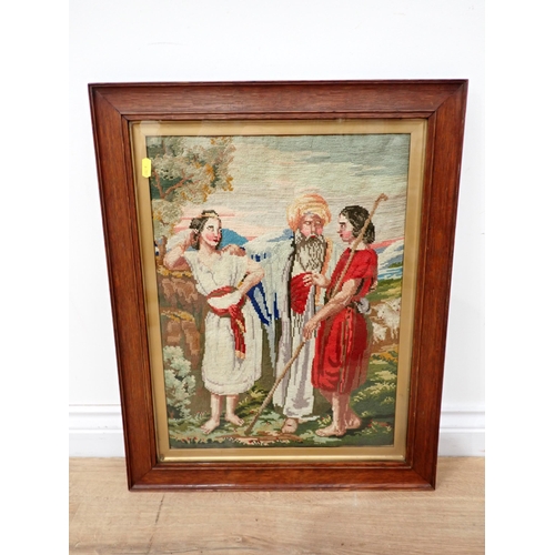 65 - An oak framed Needlework of three men in conversation