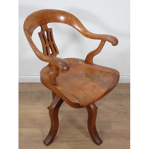 659 - A Victorian ash swivel Office Chair with pierced splat back