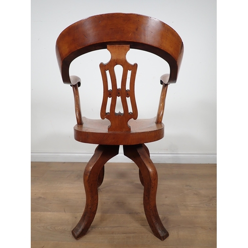 659 - A Victorian ash swivel Office Chair with pierced splat back