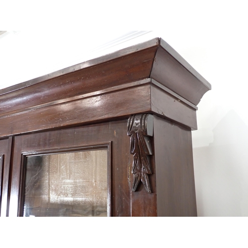 665 - A 19th Century mahogany veneered Bookcase with glazed upper section above cupboard base 6ft 6in H x ... 