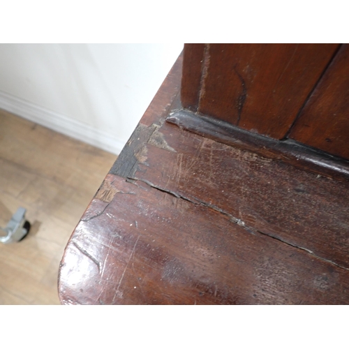 665 - A 19th Century mahogany veneered Bookcase with glazed upper section above cupboard base 6ft 6in H x ... 