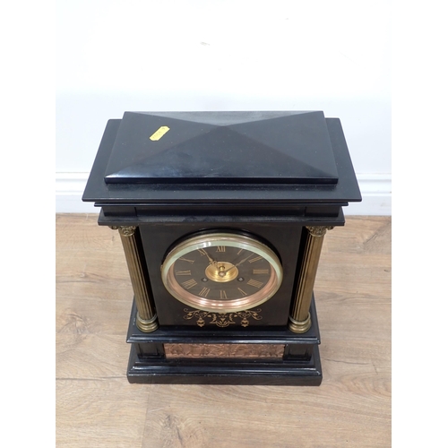 69 - A Victorian black slate Mantle Clock with gilt Corinthian columns and brass embossed panel of classi... 