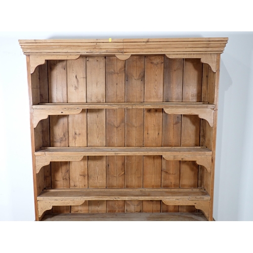 690 - A Victorian pine Dresser and Rack the base fitted three drawers mounted upon turned supports 6ft 3in... 