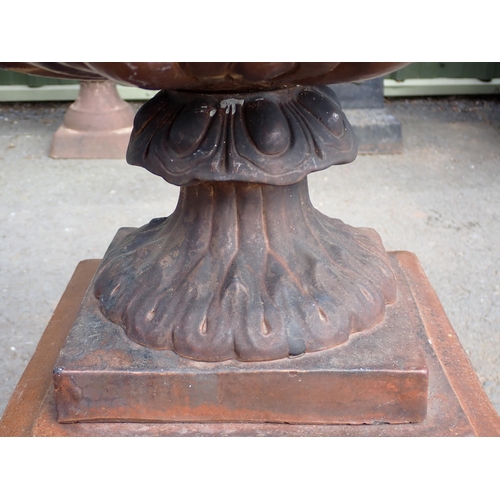 709 - A terracotta salt glazed Urn on pedestal with laurel wreath decoration 2ft 4in H