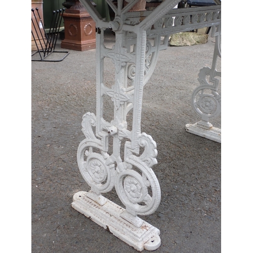 711 - A white painted cast iron Table Base with slate top, 4ft W x 2ft 5in H