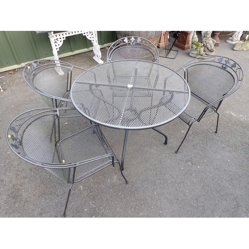 713 - A metal Garden Table  and four Chairs