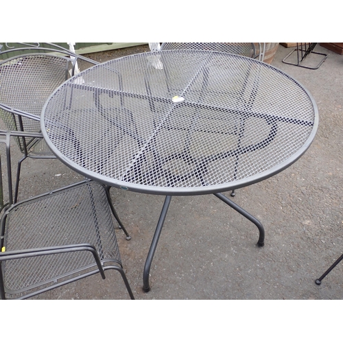 713 - A metal Garden Table  and four Chairs