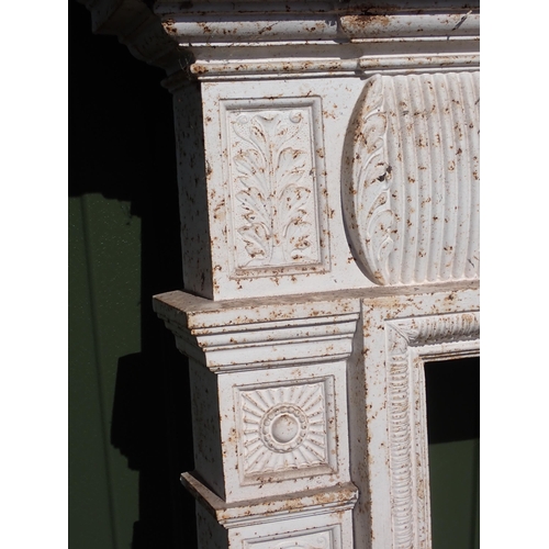 716 - A white painted cast iron Fire Surround with marble hearth