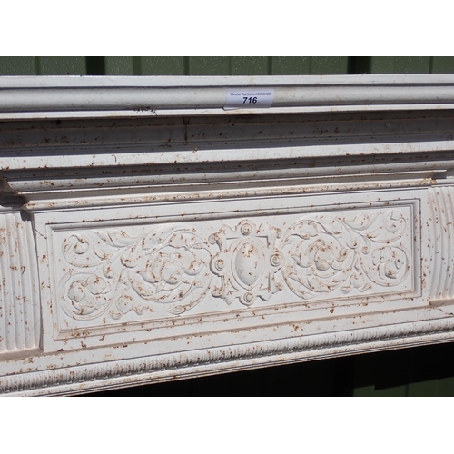 716 - A white painted cast iron Fire Surround with marble hearth