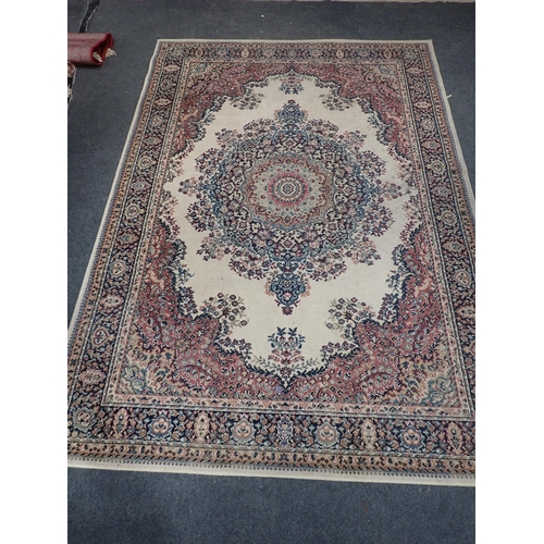 735 - A cream ground woollen Rug with central floral motif within tramline border 7ft 1in L x 5ft 4in W