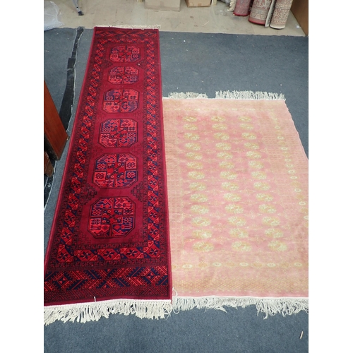 737 - A pink ground Oriental Rug 5ft 6in L x 4ft W and a red ground Runner 9ft 2in L x 2ft 3in W